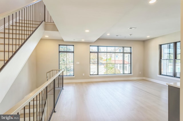 interior space with light wood-type flooring and plenty of natural light