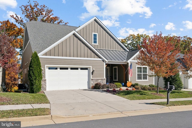 view of front facade with a garage and a front yard