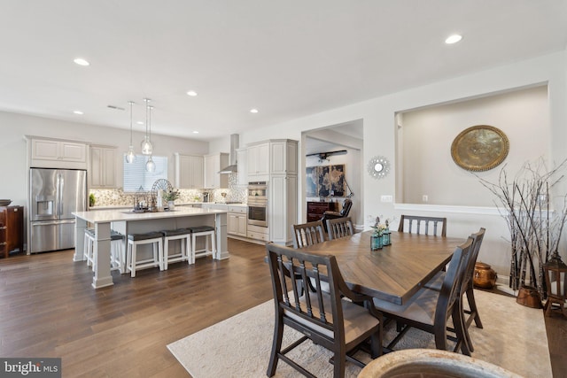 dining room with dark hardwood / wood-style flooring