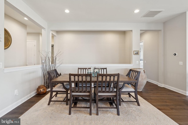 dining area featuring dark hardwood / wood-style floors