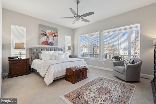 bedroom with light colored carpet and ceiling fan