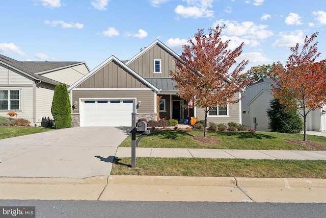 view of front of home featuring a garage and a front lawn