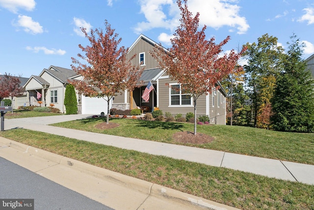 view of property hidden behind natural elements featuring a garage and a front yard