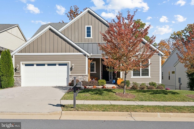 view of front facade with a garage and a front lawn