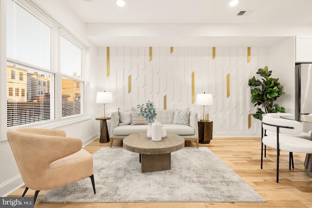 sitting room featuring light hardwood / wood-style flooring