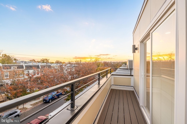 view of balcony at dusk