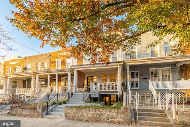 view of property featuring covered porch