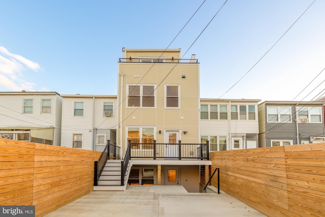 back of property with a patio