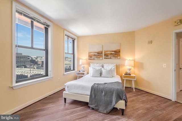 bedroom with wood-type flooring