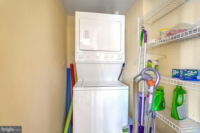 laundry area featuring stacked washer and clothes dryer