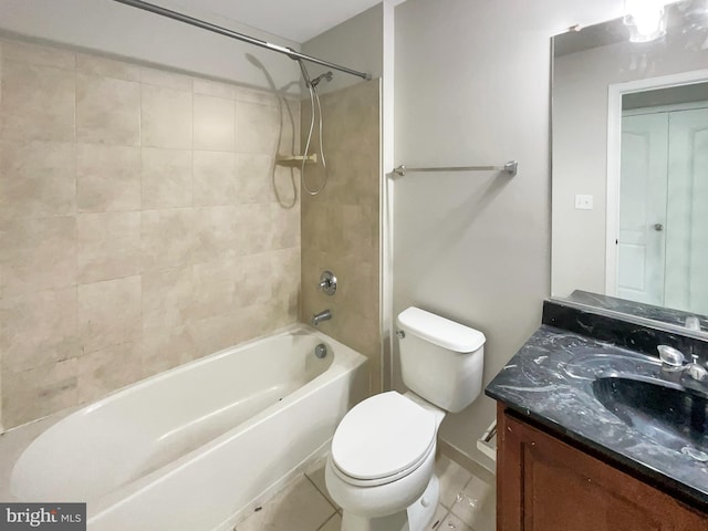 full bathroom with toilet, tiled shower / bath combo, vanity, and tile patterned floors