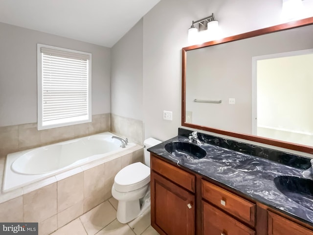 bathroom featuring tile patterned flooring, a relaxing tiled tub, vanity, lofted ceiling, and toilet