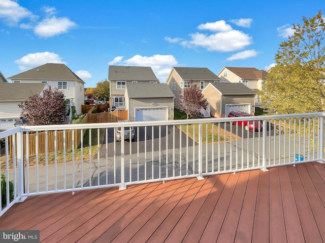 wooden terrace with a garage