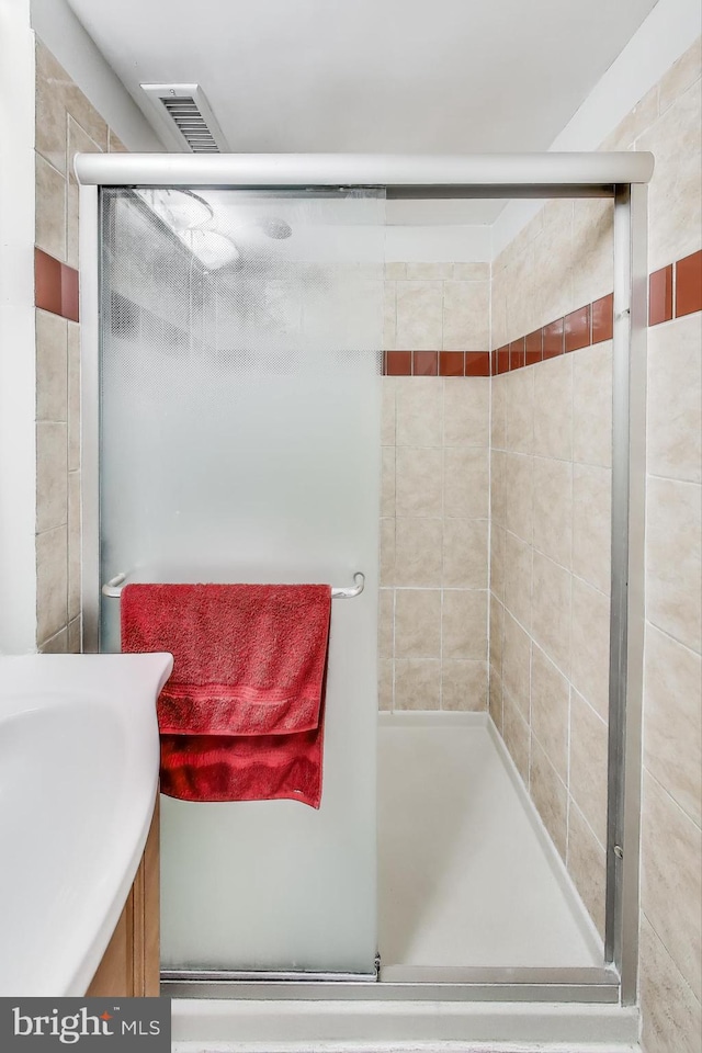 bathroom featuring walk in shower