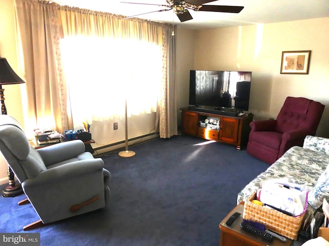 living room with baseboard heating, dark colored carpet, and ceiling fan