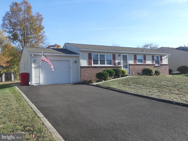 ranch-style house with a front lawn and a garage