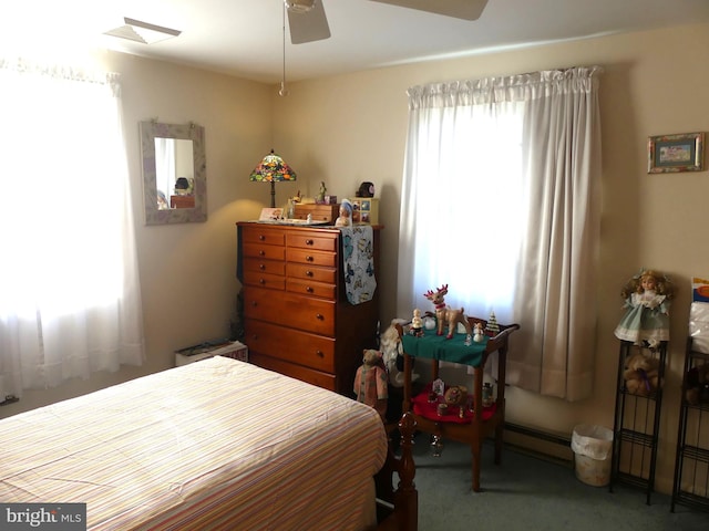 bedroom featuring baseboard heating, carpet floors, and ceiling fan