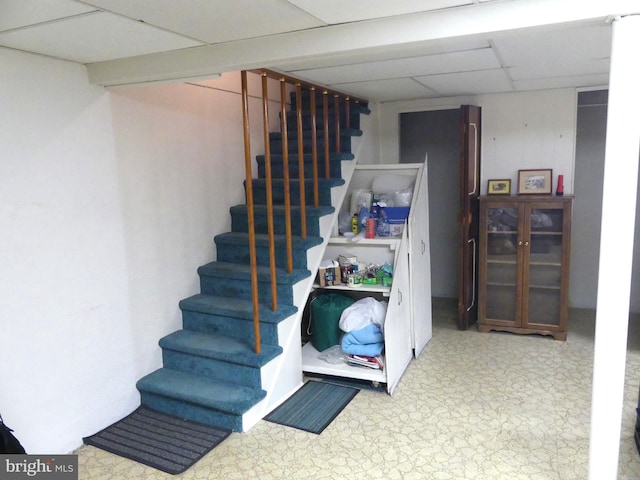 basement featuring a drop ceiling