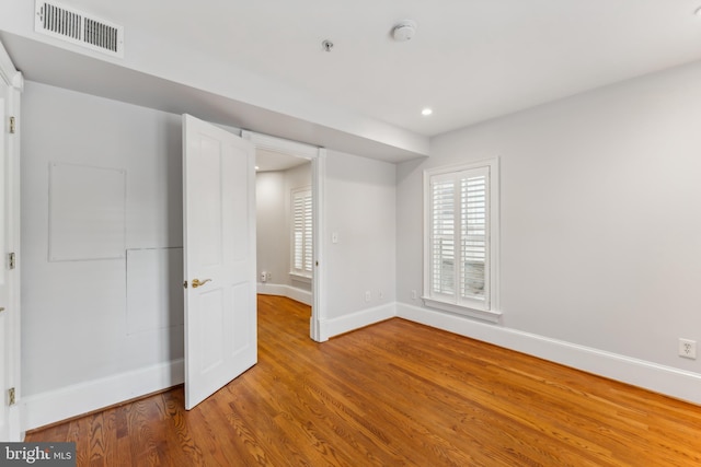 unfurnished bedroom with hardwood / wood-style floors