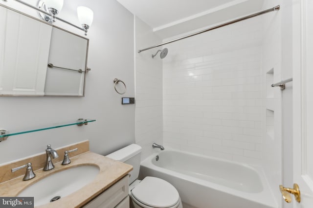 full bathroom with vanity, toilet, and tiled shower / bath