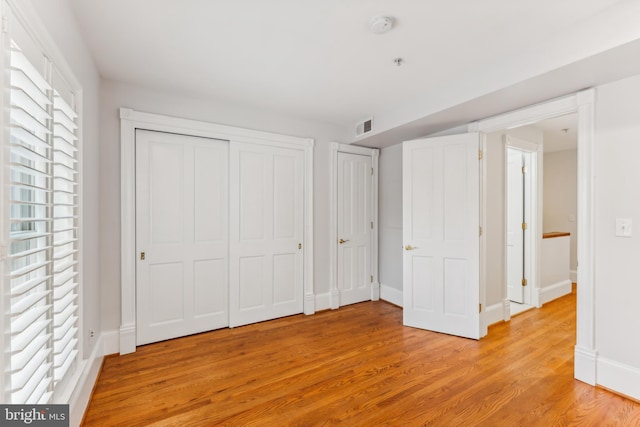 unfurnished bedroom with light hardwood / wood-style floors