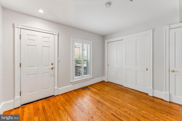 entrance foyer with light wood-type flooring