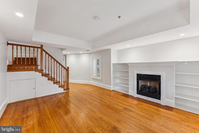 unfurnished living room featuring light wood-type flooring