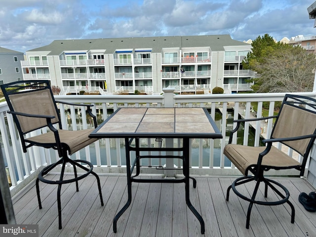 balcony featuring a water view