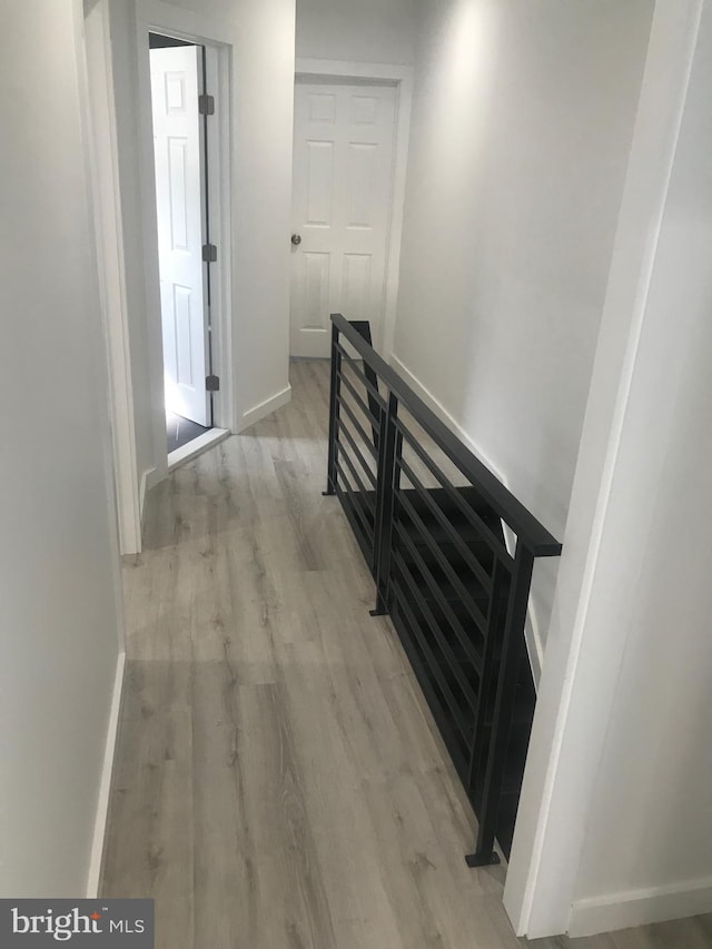 hallway with light wood-type flooring