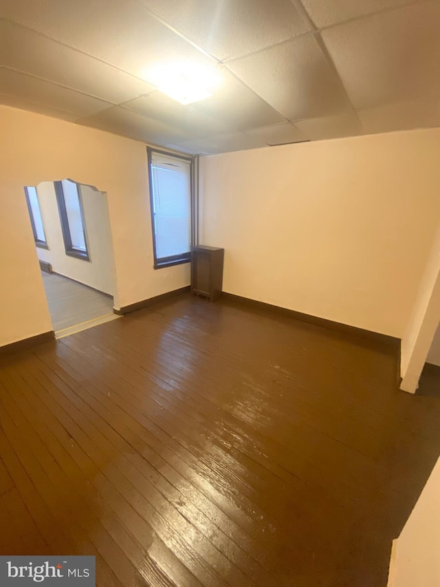 additional living space featuring dark hardwood / wood-style flooring and a wealth of natural light