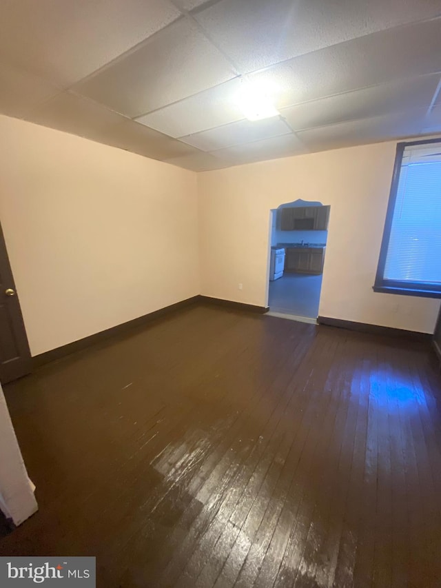 spare room featuring dark hardwood / wood-style flooring