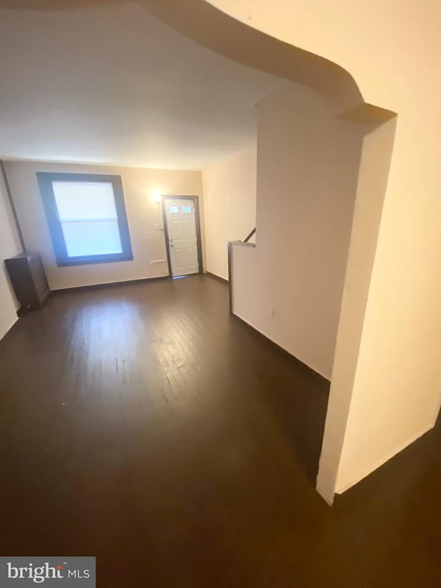 bonus room with dark hardwood / wood-style floors