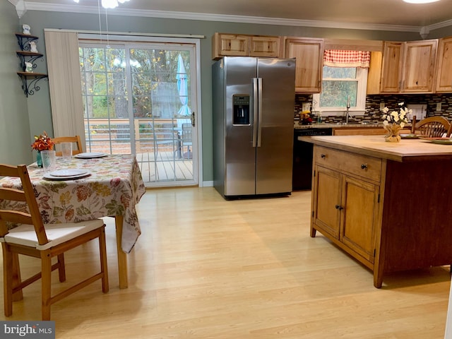 kitchen featuring light wood finished floors, decorative backsplash, dishwashing machine, crown molding, and stainless steel refrigerator with ice dispenser