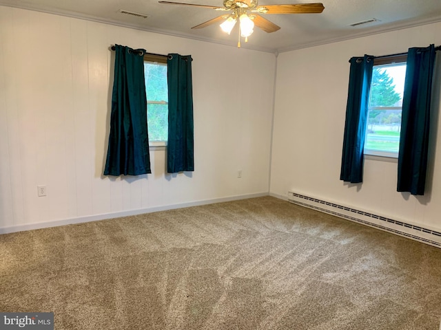 carpeted empty room with a baseboard radiator, visible vents, a ceiling fan, and ornamental molding