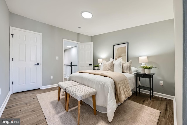 bedroom with hardwood / wood-style flooring