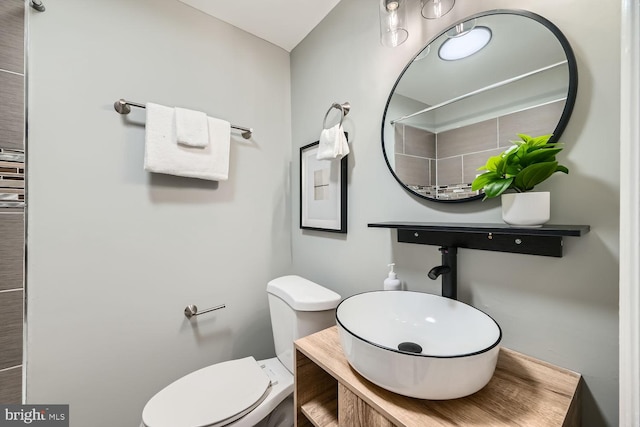 bathroom featuring toilet and sink