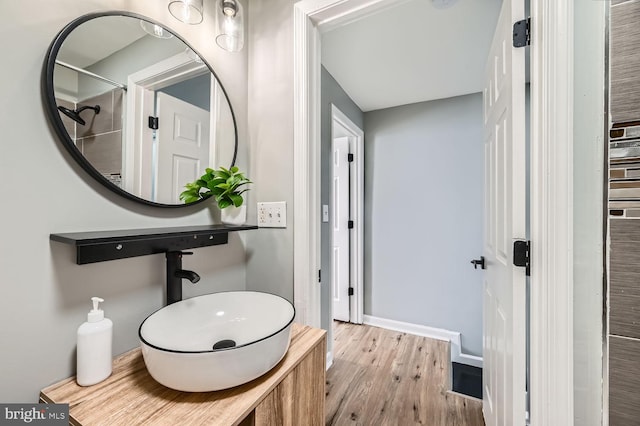 bathroom with hardwood / wood-style flooring and sink