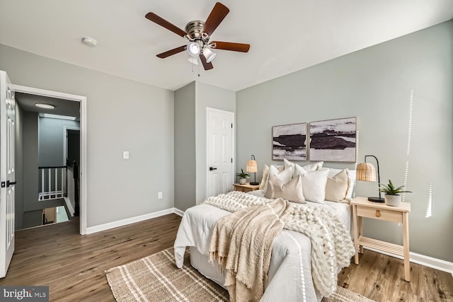 bedroom featuring wood-type flooring and ceiling fan