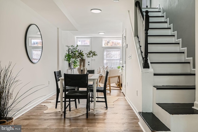 dining area with hardwood / wood-style flooring