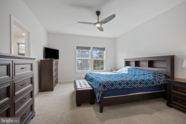 bedroom featuring light colored carpet and ceiling fan