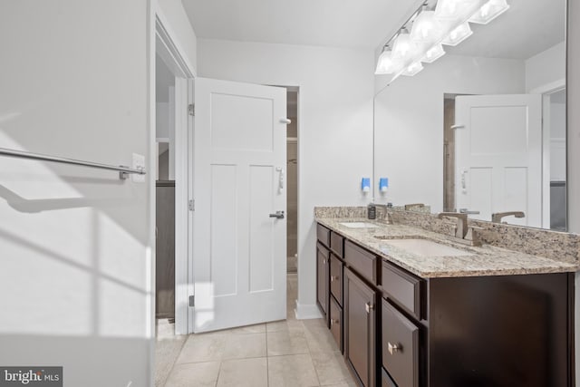 bathroom featuring tile patterned floors and vanity