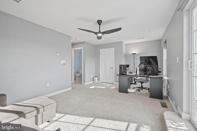 office area with ceiling fan and light colored carpet