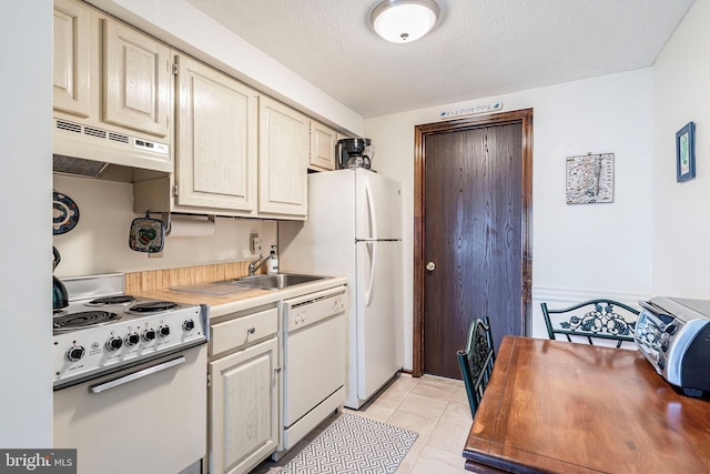 20 Amber St Unit E3, Beach Haven, NJ 08008 - kitchen featuring white appliances, under cabinet range hood, a sink, light tile patterned floors, and light countertops