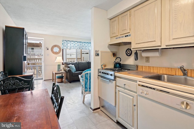 20 Amber St Unit E3, Beach Haven, NJ 08008 - kitchen with white appliances, under cabinet range hood, a sink, a textured ceiling, and light countertops