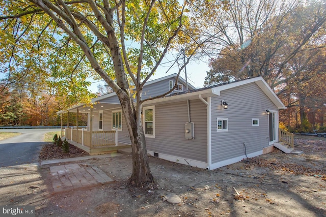 view of home's exterior featuring covered porch