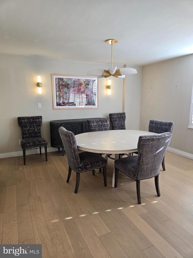 dining area with light hardwood / wood-style floors