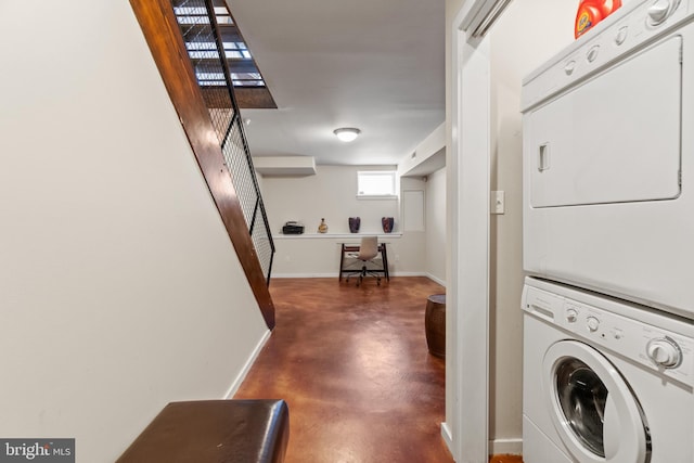 clothes washing area with stacked washer and clothes dryer