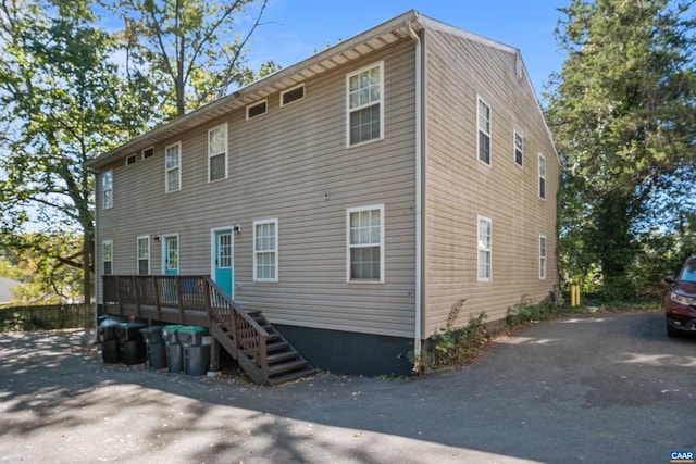 rear view of property with a wooden deck