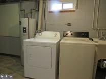 washroom featuring washer and clothes dryer