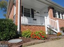 view of side of home featuring a balcony